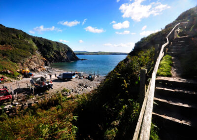 View of Porth Meudwy beach and boats to Bardsey Island Llyn Peninsula North Wales