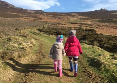 Children walking up the mountain from Gors-lwyd Cottage Yr Eifl Llithfaen